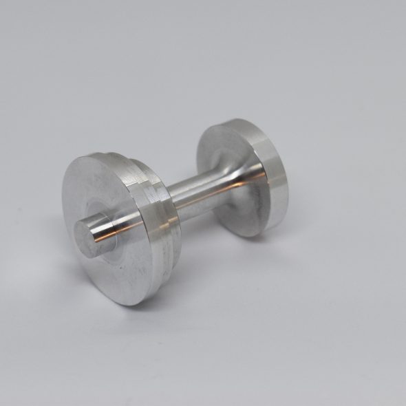 Small metal cylinder with round ends on a plain light background.