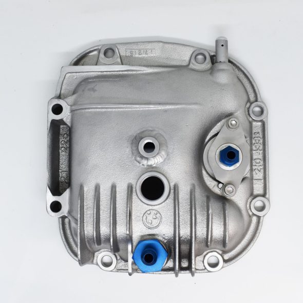 A metal automotive backplate with blue plastic plugs on a white background.