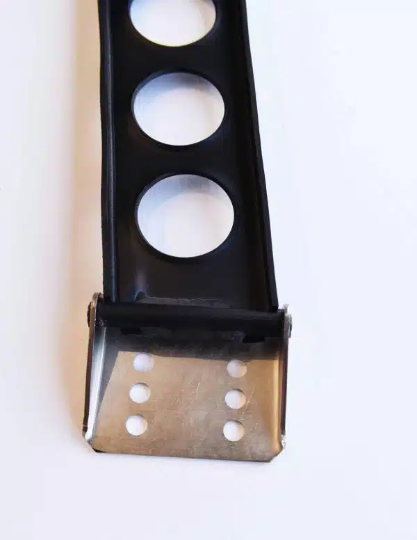 Black and metal racing throttle pedal with circular cutouts on a white background.