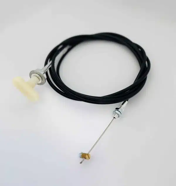 Black cable with a white plastic knob and metal ends, coiled on a white surface.