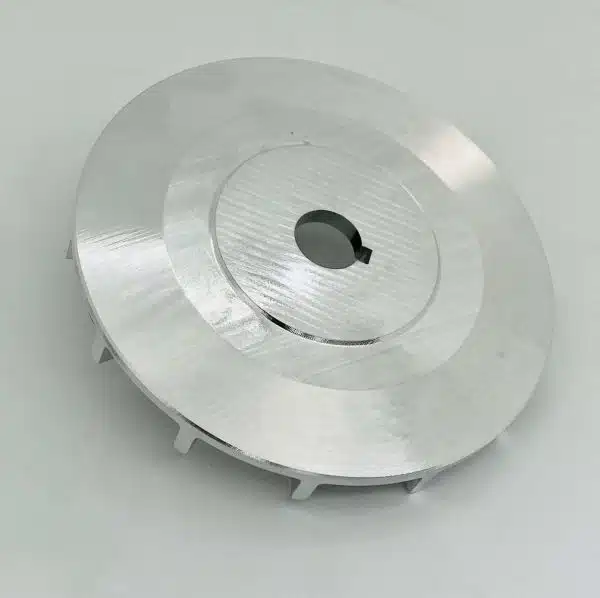 Round metal component with a central hole, placed on a plain white background.