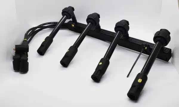 Set of ignition leads and connectors for a car engine, displayed on a white background.