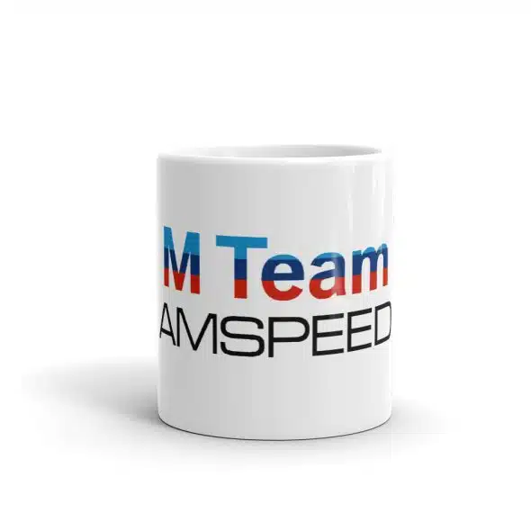 White mug with partial text "M Team" in blue and "AMSPEED" in black on the side.