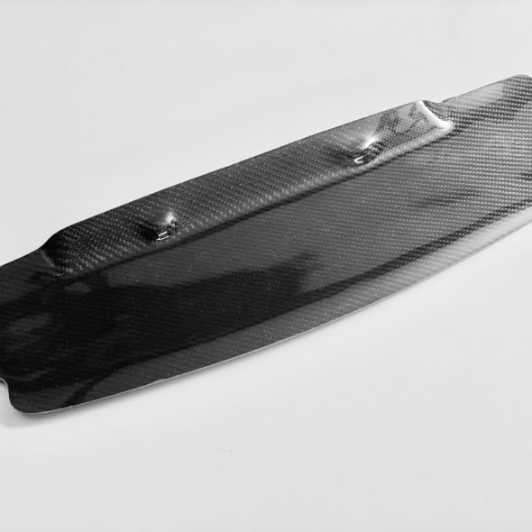 Black carbon fiber car part on a white background.